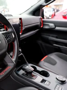 Interior detailing of a pickup truck showcasing meticulous cleaning and organization.