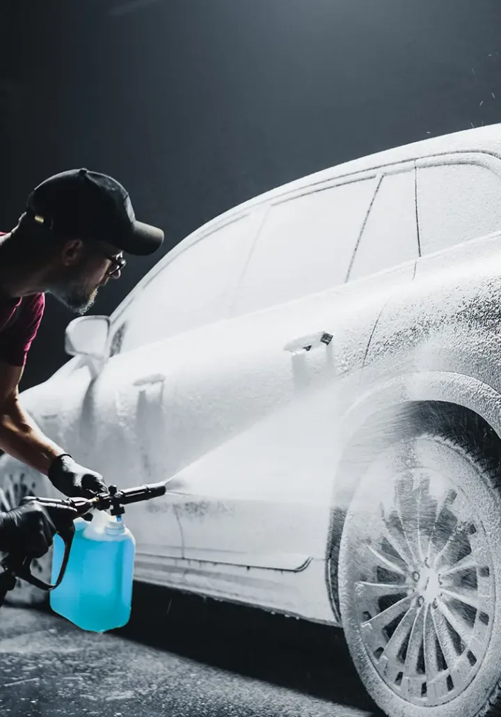 Expert exterior detailing on an SUV, highlighting the vehicle's glossy finish and meticulous cleanliness.